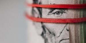 Person reviewing loan documents at desk